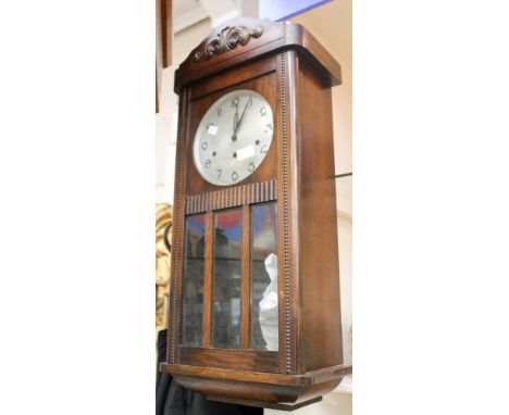 An Enfield mantle clock Westminster chime; together with a post World War Two (marked foreign) wall clock (wood surround and 