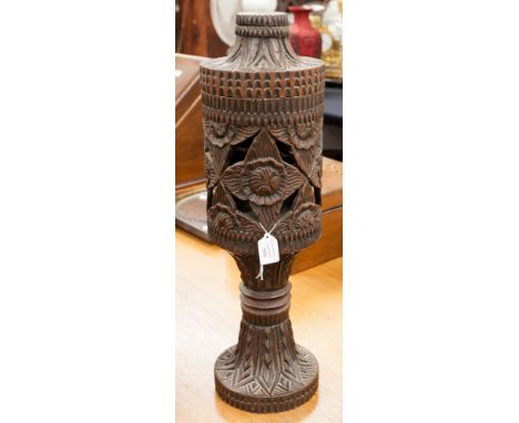 A Hispanic carved base and cover which could be converted to a lamp previously used as a storm light 