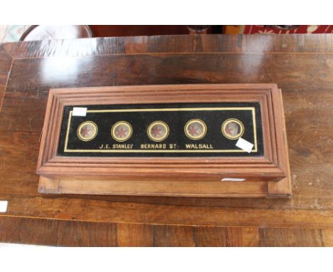 A wall hanging item stamped (J.E. Stanley Bernard St Walsall 