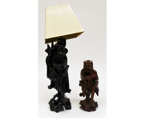 A carved oriental figure, approx 10", split to base, af. And a carved oriental figure as a lamp base with shade, approx 18" w