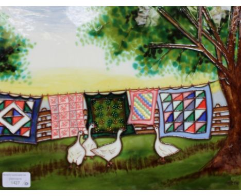 A large tubelined ceramic tile depicting geese and cloths on washing line, signed Malo approx 28 cm x 35 cm 