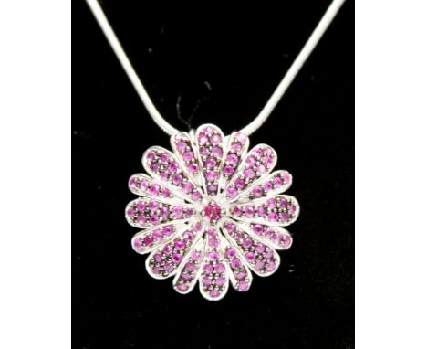 A Ruby and silver pendant necklace, the pendant set with 97 ruby chips, of approximately 3.4cts in total,  each claw set and 
