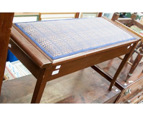 An Edwardian mahogany duet piano stool, raised on square legs.