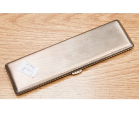 A George V silver double cigarette case, engine turned, slim line, Birmingham 1935, 17 cm long approx, 4.14 ozt approx 