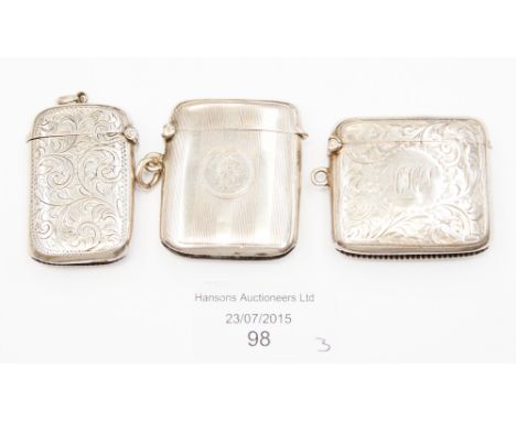 Three silver vesta cases including chased and engine turned designs, various assays and date including Chester, 2.38 ozt appr