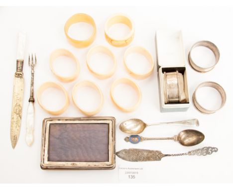 Three hallmarked napkins seven ivory napkin rings, a silver spoon mother of pearl handled fork/knife white metal knife, etc, 