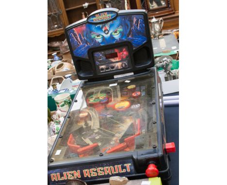 A table football game and an Alien Assault pinball game, two light sabre's, etc 