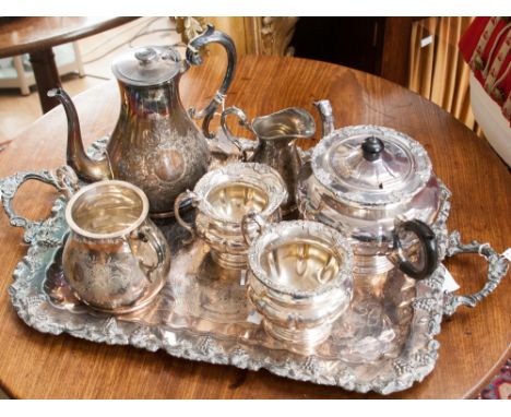 A late Victorian three piece tea service; together with a four piece tea service, comprising teapot, milk jug, sugar bowl and