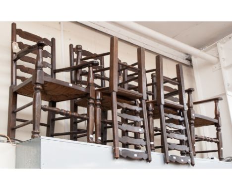 A set of six oak ladder back chairs with rush seats.