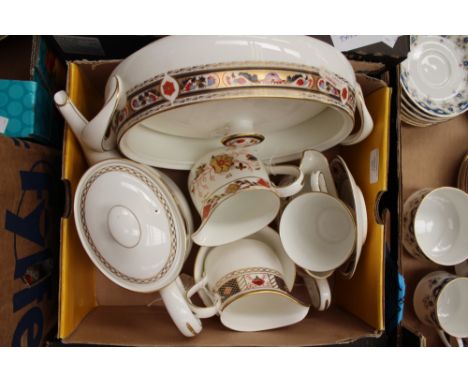 A collection of Royal Crown Derby comprising coffee pot, gravy boat and stand, cup, saucer and sugar bowl, tureen and two mil