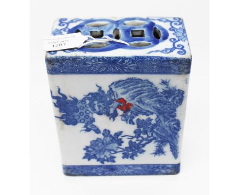 A blue and white ceramic pillow 
