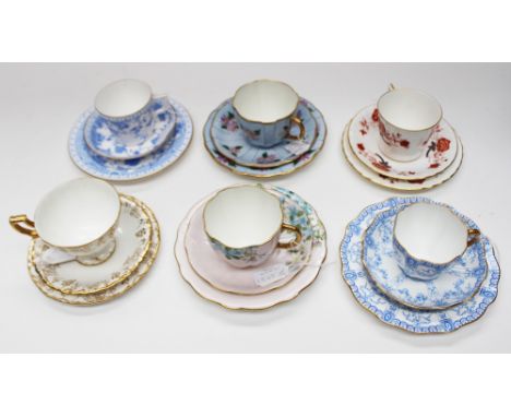 Six Royal Crown Derby trios, all early to mid 20th century, each with a cup, saucer and side plate of various designs, compri