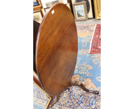 A George III oak and ash tilt top tripod table, with heavy turned column, 70 cm high approx 