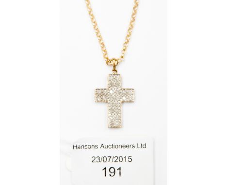 ***REOFFER AUGUST £150/200** A diamond set cruciform pendant in 9ct yellow and white gold pave setting suspended from 9ct gol