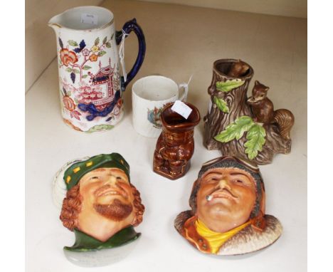 A Japanese novelty ceramic musical box with moving part, a Chinoiserie jug 1892, two bosson wall plaques, Toby jug and Commem