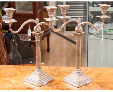 A pair of Victorian silver and silver plated two branch candelabra, of Corinthian column form on stepped square bases with be