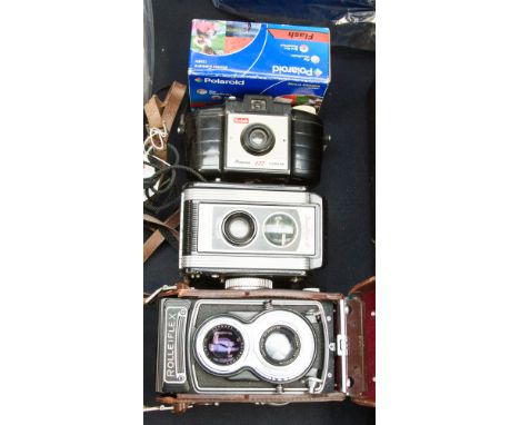 A Rolleiflex T75 mm  3.5 Tessar camera and three others (4)