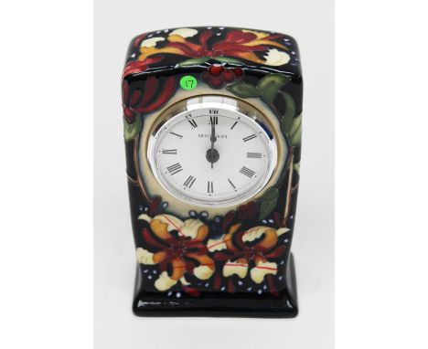 A Moorcroft 'Honeysuckle Haven' mantle clock, clock section with a white dial and black Roman numerals, the case with tube li