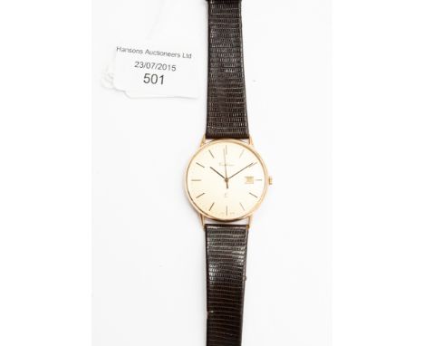 A 'Cortina' gent's slim wristwatch with baton movement, date aperture, engraved 14k, with box and guarantee.