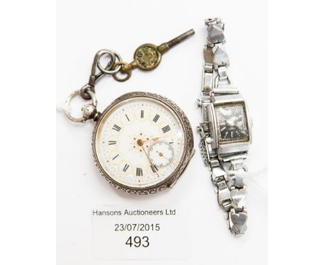 A silver engine turned Hunter, enamelled face, Roman numerals, key, with a white metal Titus ladies wristwatch (2) 
