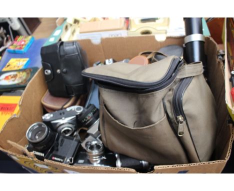 A collection of cameras, camera equipment and 1960 cartoon cine reels, two boxes 