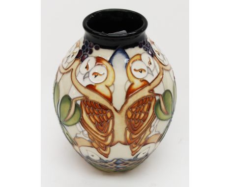 A Moorcroft 'Whoot' vase, of squat ovoid form, with tube lined decoration on light coloured ground, dated 2013, 1st quality, 