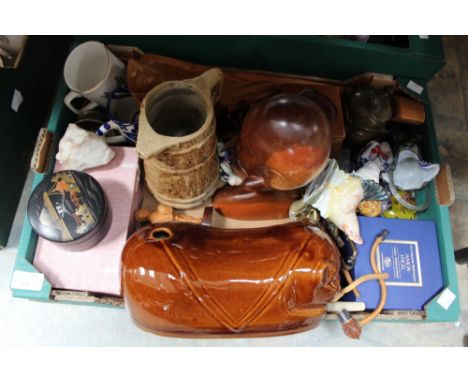 A box of assorted items including Wade Humpty Dumpty. g;ass paperweights, ceramic hot water bottle, etc 