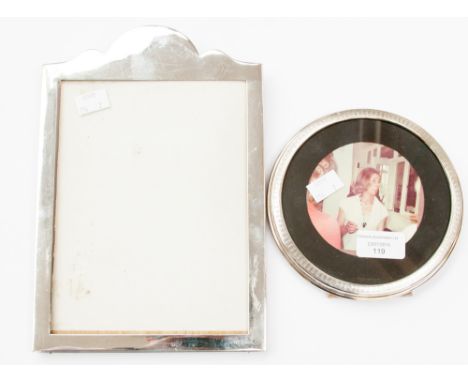 A silver framed rectangular mirror; together with an engine turned circular easel back mirror with oak back (2) 