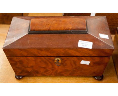 An early Victorian mahogany tea caddy of sarcophagus form, replacement mixing bowl 