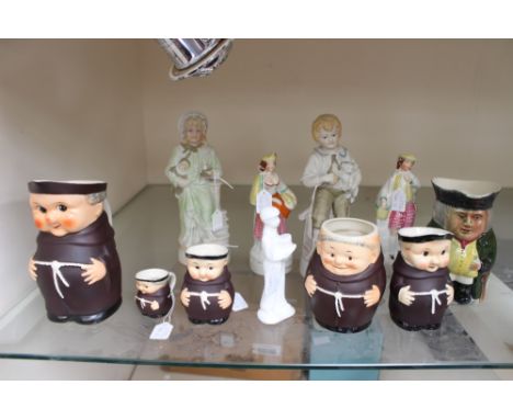 A collection of figures, comprising Royal Doulton classics 'Page Boy', a pair of Victorian Staffordshire figures, a Toby Jug,