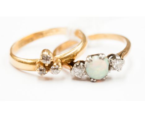 Two 18ct gold rings, one set with opal and two diamonds, one set with three diamond chips 