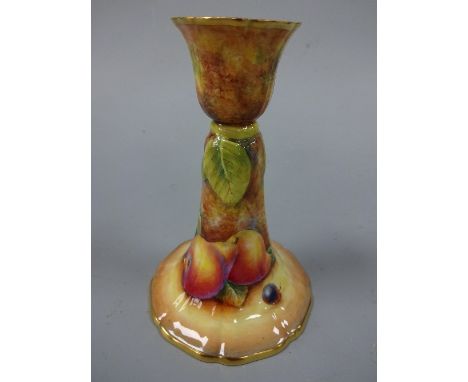 A ROYAL WORCESTER CANDLESTICK, hand painted with pears and cherries to mossy bank, gilt shaped foot, signed D Fuller, black p