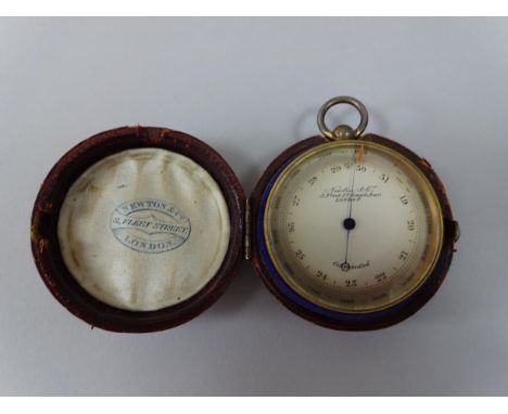 A TRAVEL COMPENSATED ANEROID BAROMETER, the dial inscribed Newton & co 3 Fleet St Temple Bar London, approximately 5cm diamet