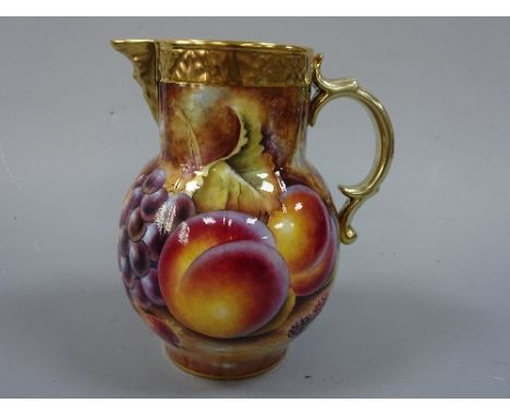 A ROYAL WORCESTER MASK HEAD JUG, having hand painted apples, grapes and berries to mossy bank body, gilt handle, rim, foot an