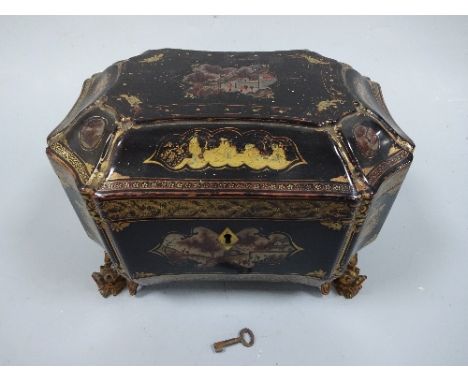 A 19TH CENTURY CANTONESE LACQUERED TEA CADDY, of shaped octagonal form having cartouches depicting figures in domestic scenes