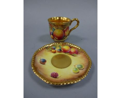A ROYAL WORCESTER COFFEE CAN AND SAUCER, with hand painted peach, apple and cherry decoration to mossy bank, signed D Fuller,