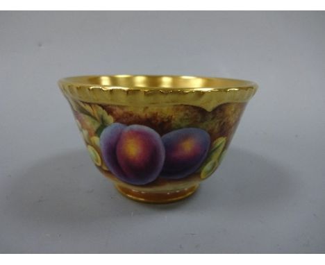 A ROYAL WORCESTER SUGAR BOWL, hand painted with plums, grapes and berries to mossy bank, gilt shaped rim, foot and interior, 