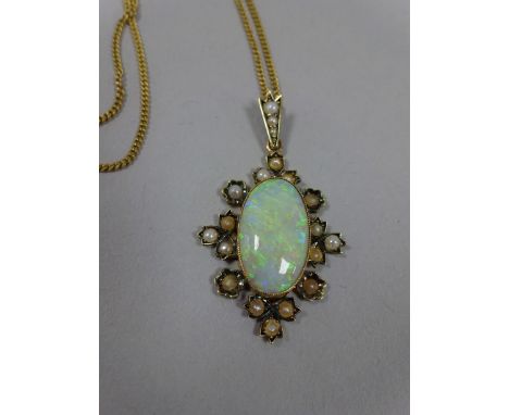 AN OPAL AND PEARL PENDANT, with oval shape opal within a surround of seed pearls with scalloped border to a fine chain, dimen