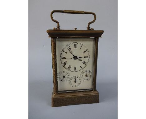 A LARGE CARRIAGE CLOCK, with swing handle, the case engraved with scroll and leaf design, Roman numeral chapter ring over thr