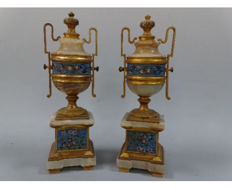 A PAIR OF CLOISONNE MOUNTED ONYX GARNITURES, of urn form with central floral banding, gilt high loop handles and finial set o