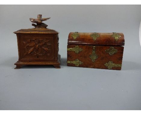 A CARVED BLACK FOREST HUMIDOR, with Partridge finial to lifting front and lid to reveal five cigar slide interior, carved and