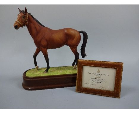 A ROYAL WORCESTER BISQUE RACEHORSE, modelled as Nijinsky by Doris Lindner on oval naturalistic base raised on mahogany plinth