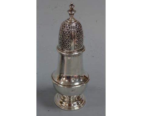 A SILVER SUGAR CASTER, of baluster form, pierced diamond shape engraved top section with urn finial, circular foot, London 19