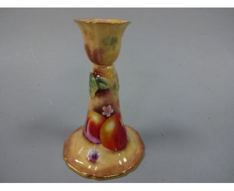 A ROYAL WORCESTER CANDLESTICK, hand painted with apples and grapes to mossy banks, gilt shaped foot, signed K. Mason, black p