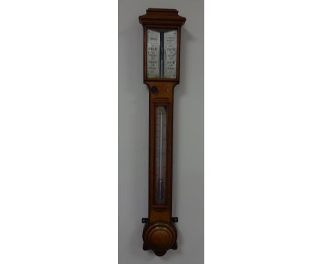 A 19TH CENTURY OAK STICK BAROMETER, with chamfered edges, demi lune cistern cover, architectural pediment, vernier sliding sc