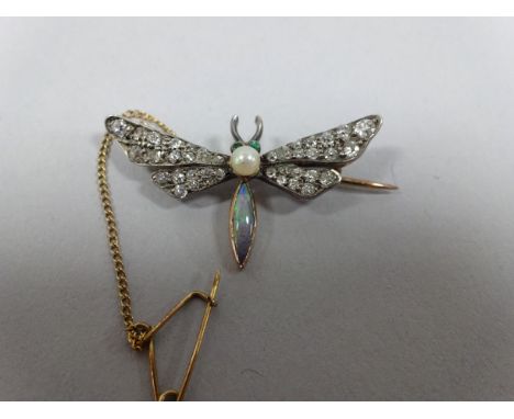 AN EARLY 20TH CENTURY BROOCH, depicting the shape of a dragon fly, with old-cut diamond, opal, emerald and pearl details, est