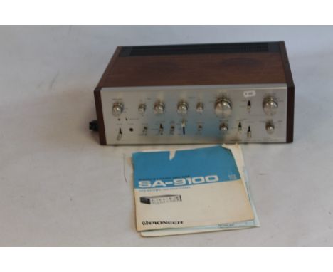 A PIONEER SA-9100 STEREO AMPLIFIER with instruction manual