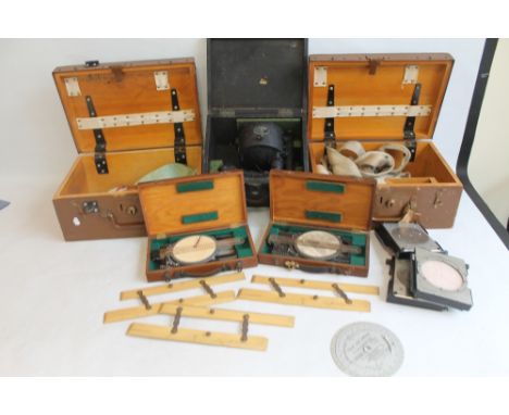 AN AIR MINISTRY ALDIS SIGNALLING LAMP IN FITTED WOODEN BOX (DATED 1941), together with two Air Ministry course and speed calc