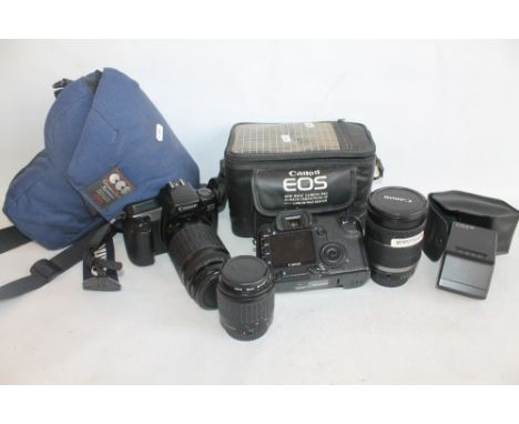 A CANON EOS 30D DIGITAL SINGLE LENS REFLEX CAMERA WITH A CANON EF.S 18-200MM LENS IN A CANON EOS CARRY CASE, together with a 