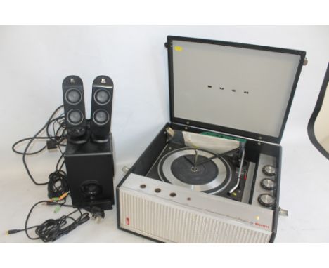 A BUSH RECORD PLAYER WITH GARRARD TURNTABLE and paperwork together with a Logitech gaming speaker set X-230